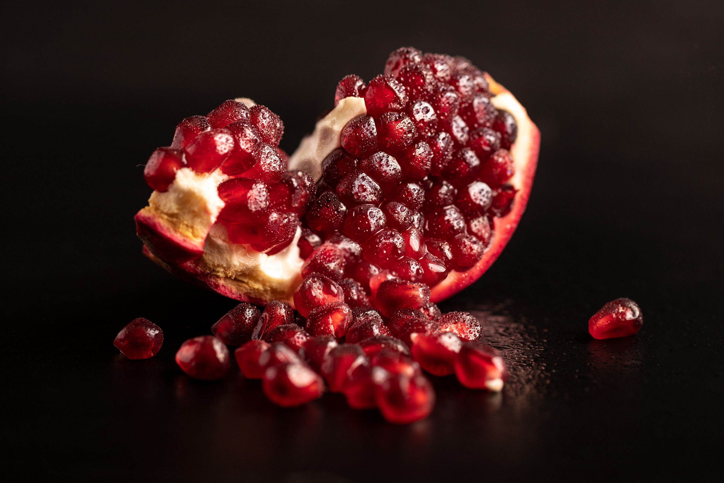 Red Round Fruits on Black Surface